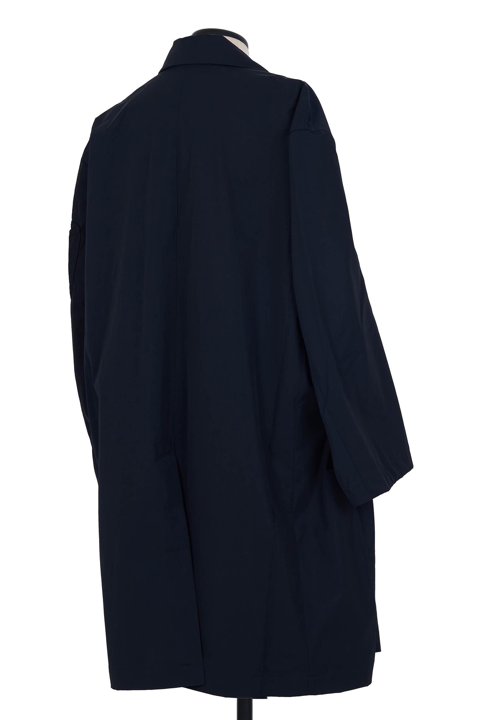 Random Identities Car Coat. Navy gabardine, oversized cut, sleeve detail close-up