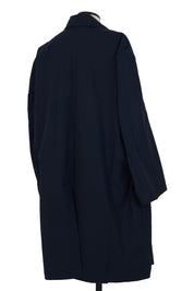 Random Identities Car Coat. Navy gabardine, oversized cut, sleeve detail close-up