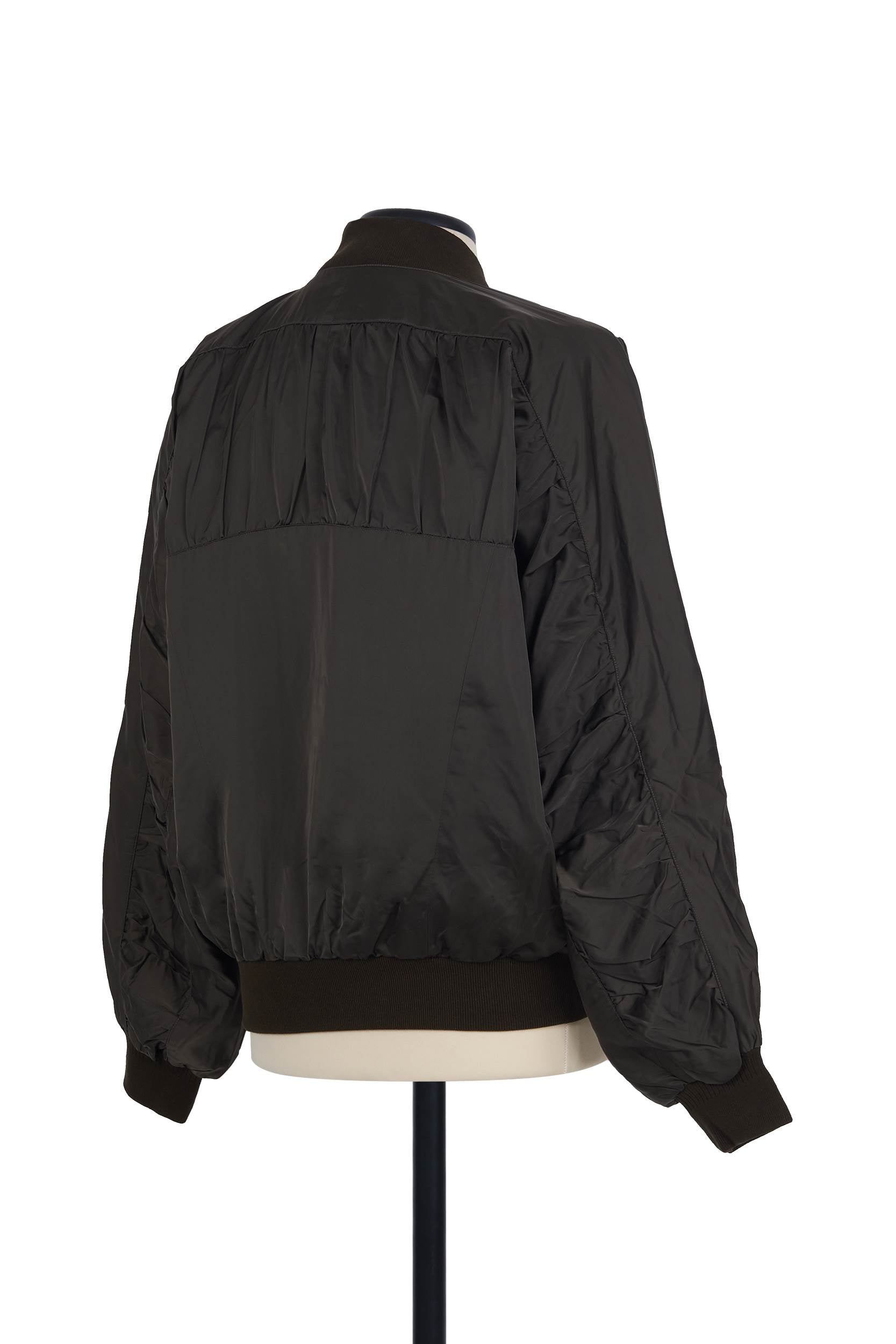 Unisex Bronze polyester bomber with ruched panels and ribbed trims