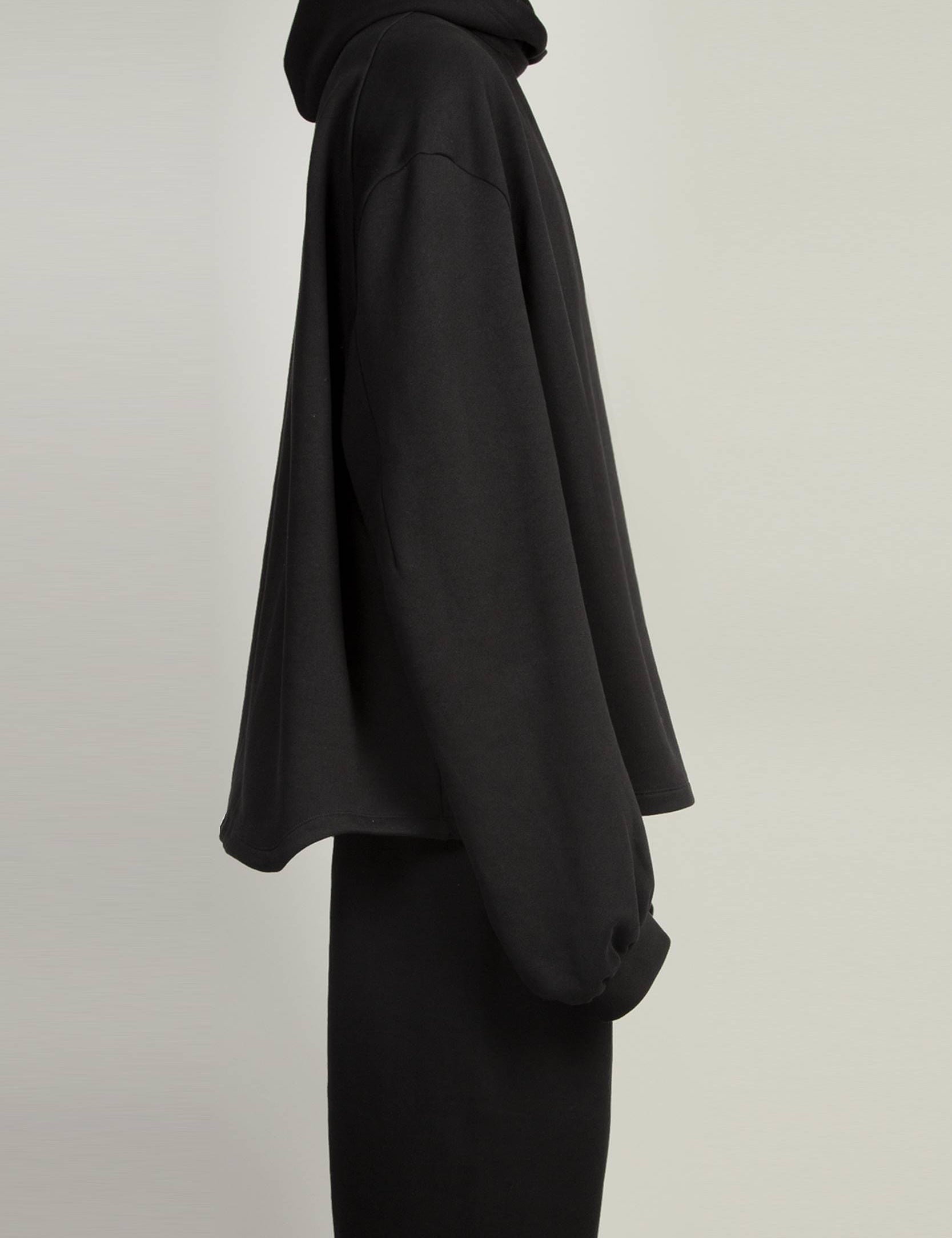 Black cutout hoodie with ribbed cuffs and hem