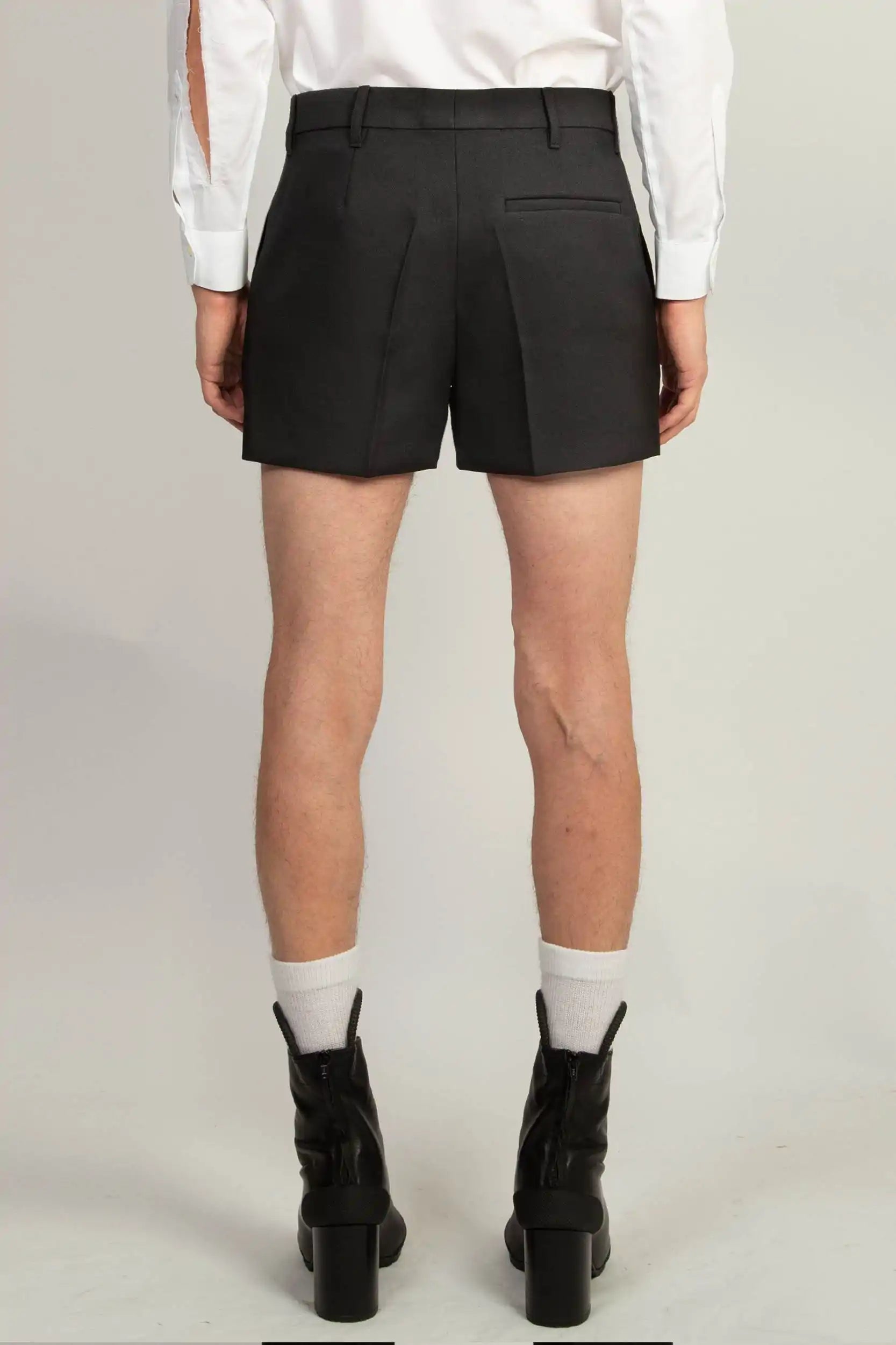 Detail of six double-button closure on the Random Identities Tailored Shorts, Black
