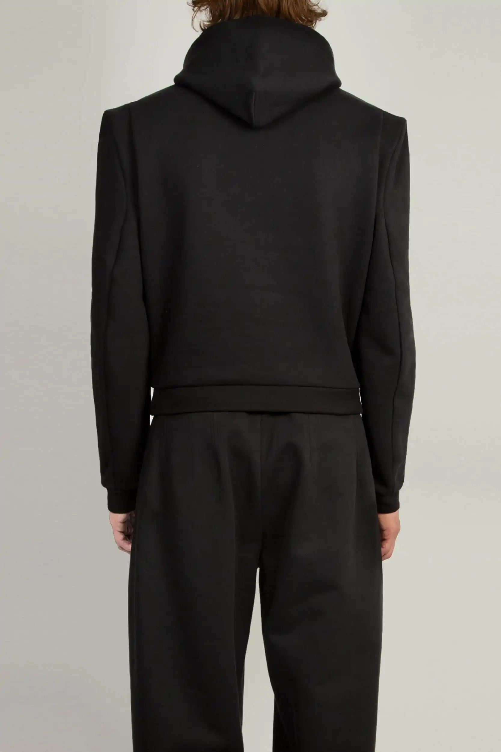 Detail shot of darted sleevehead and defined shoulder on the Random Identities Constructed Shoulder Hoody, Black