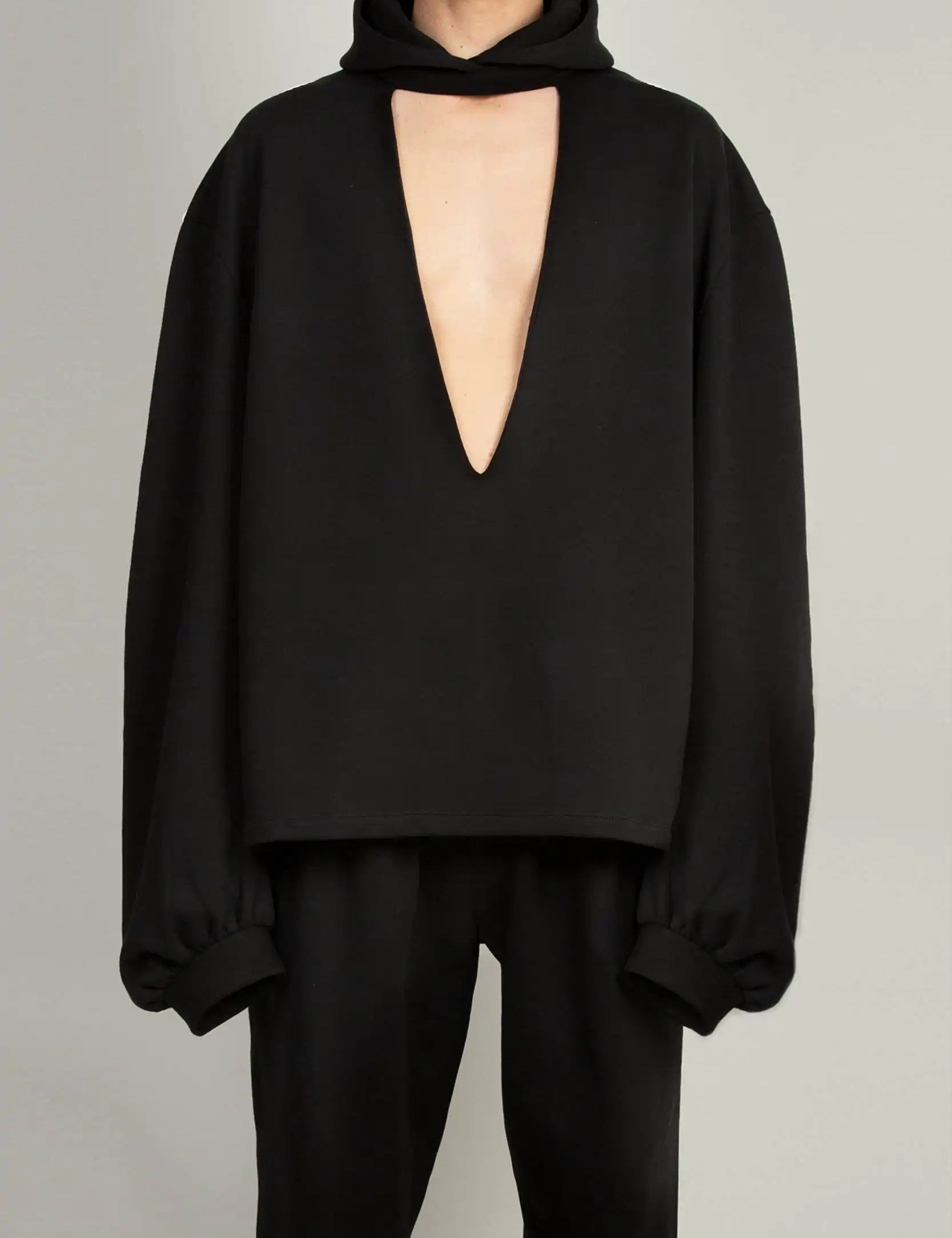 Random Identities Cutout Hoody in Black jersey with cutout details and drawstring hood