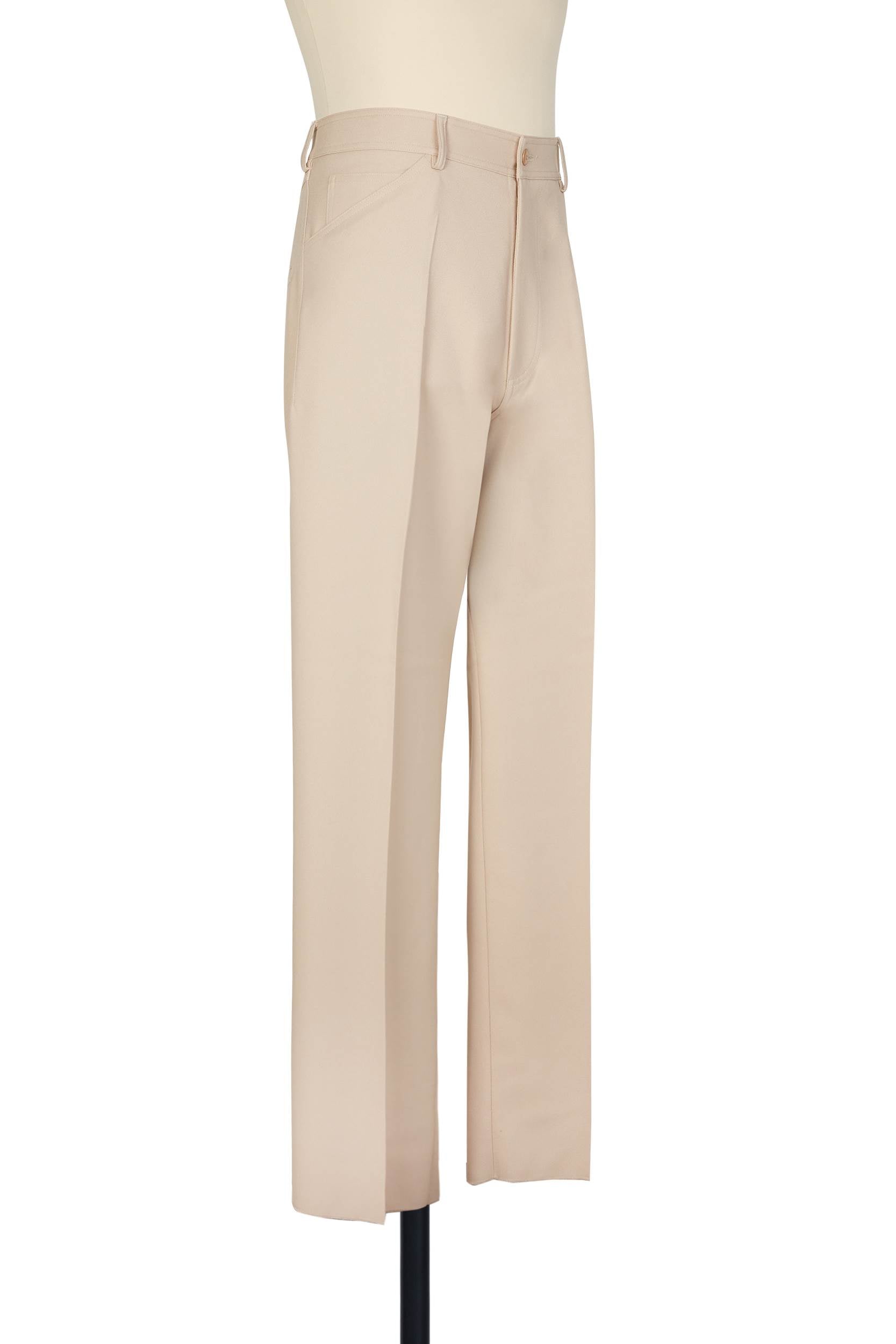 Beige high-rise trousers. single jet back pockets and yoke insert, polyester gabardine