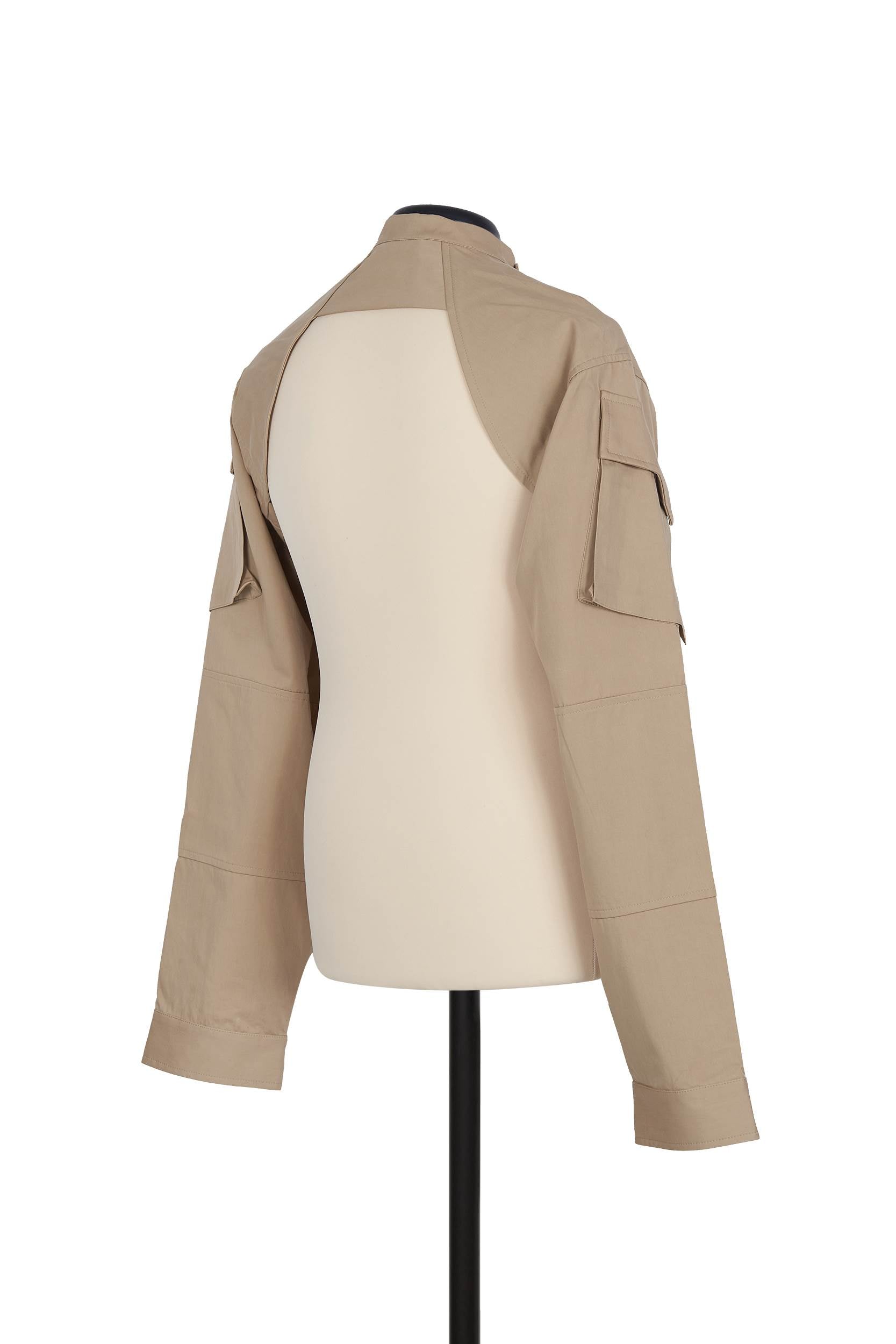 Shrug Jacket in Beige. sleeve cargo pocket detail, 100% cotton, regular fit