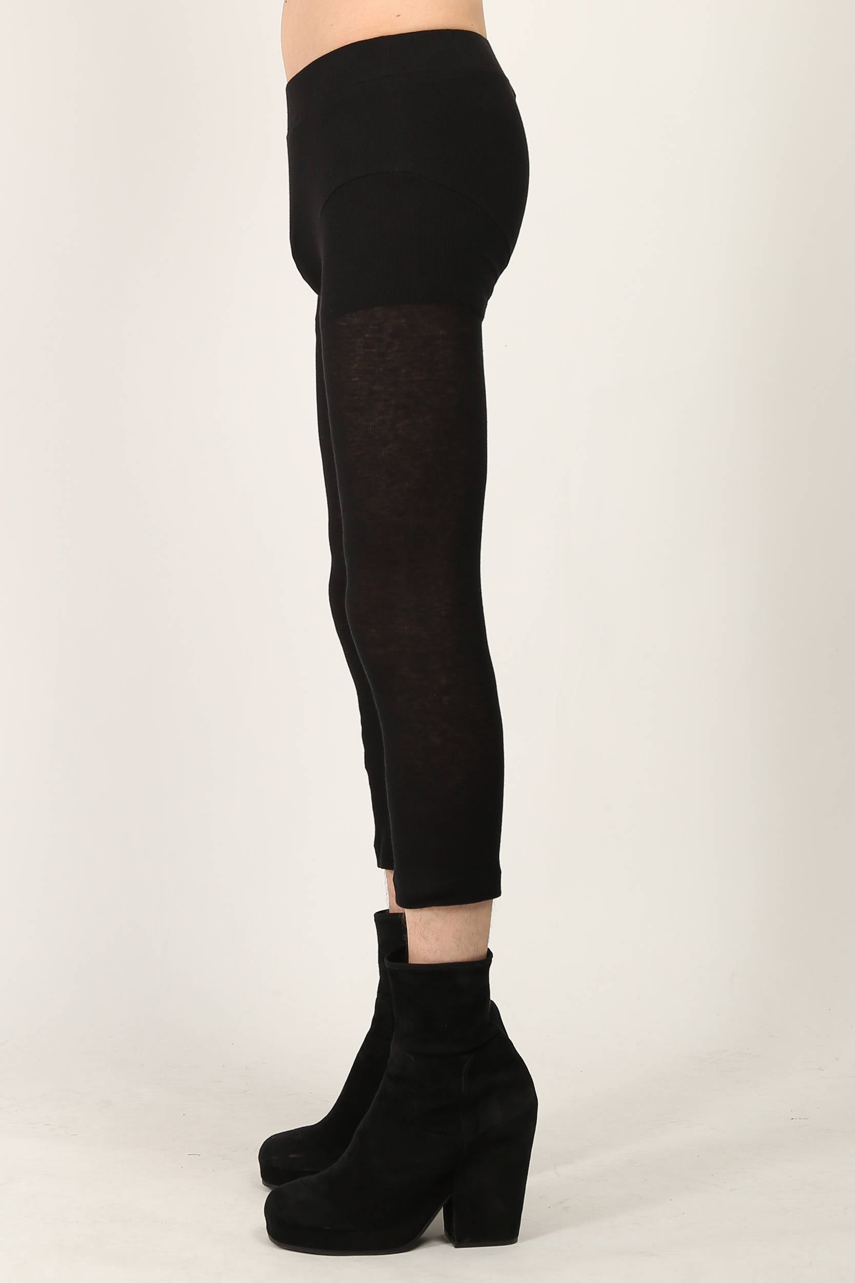 Black fine ribbed jersey leggings by Random Identities featuring split cuff and press button detail, styled with minimalist top