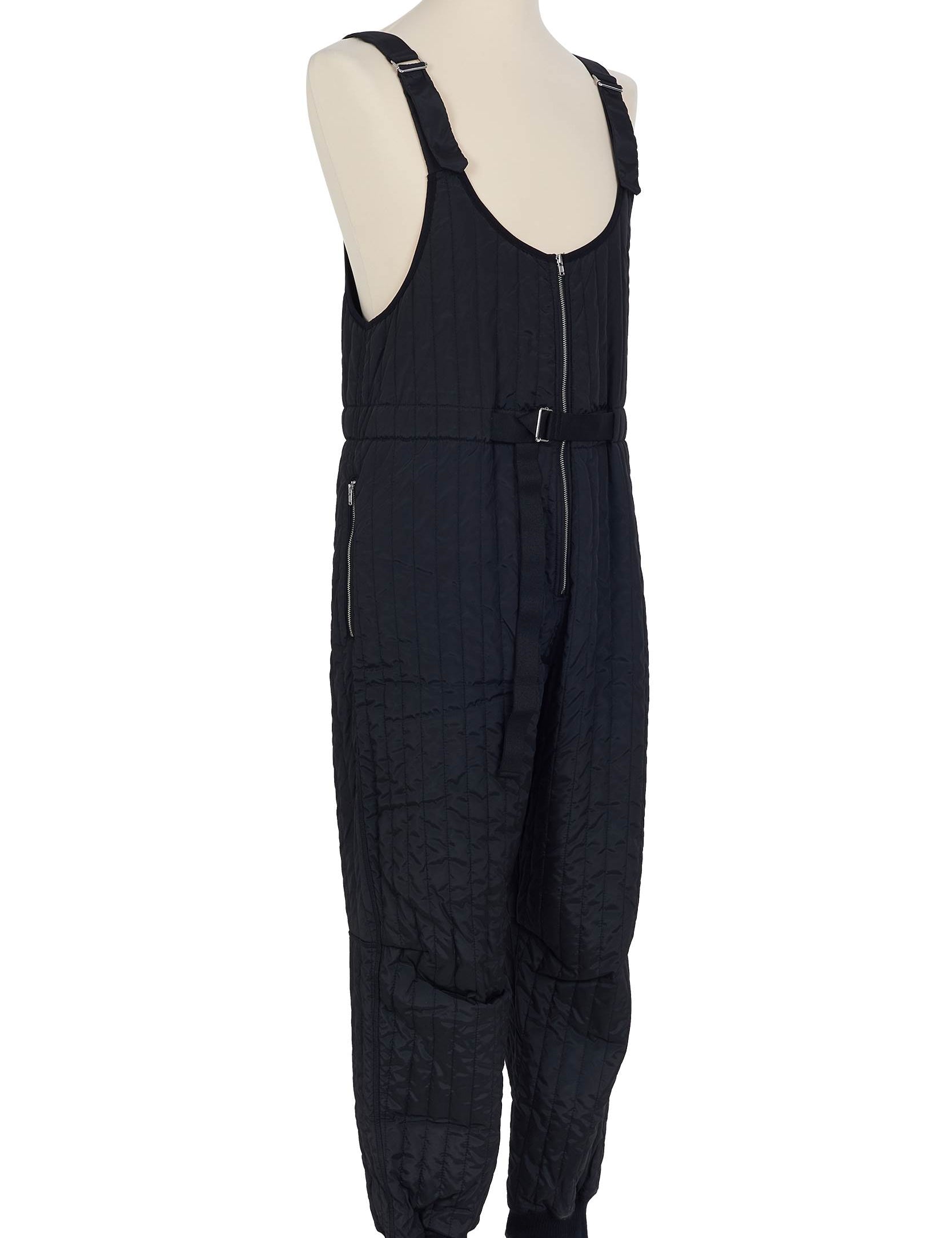 Black quilted salopette by Random Identities. adjustable length detail, 100% polyester