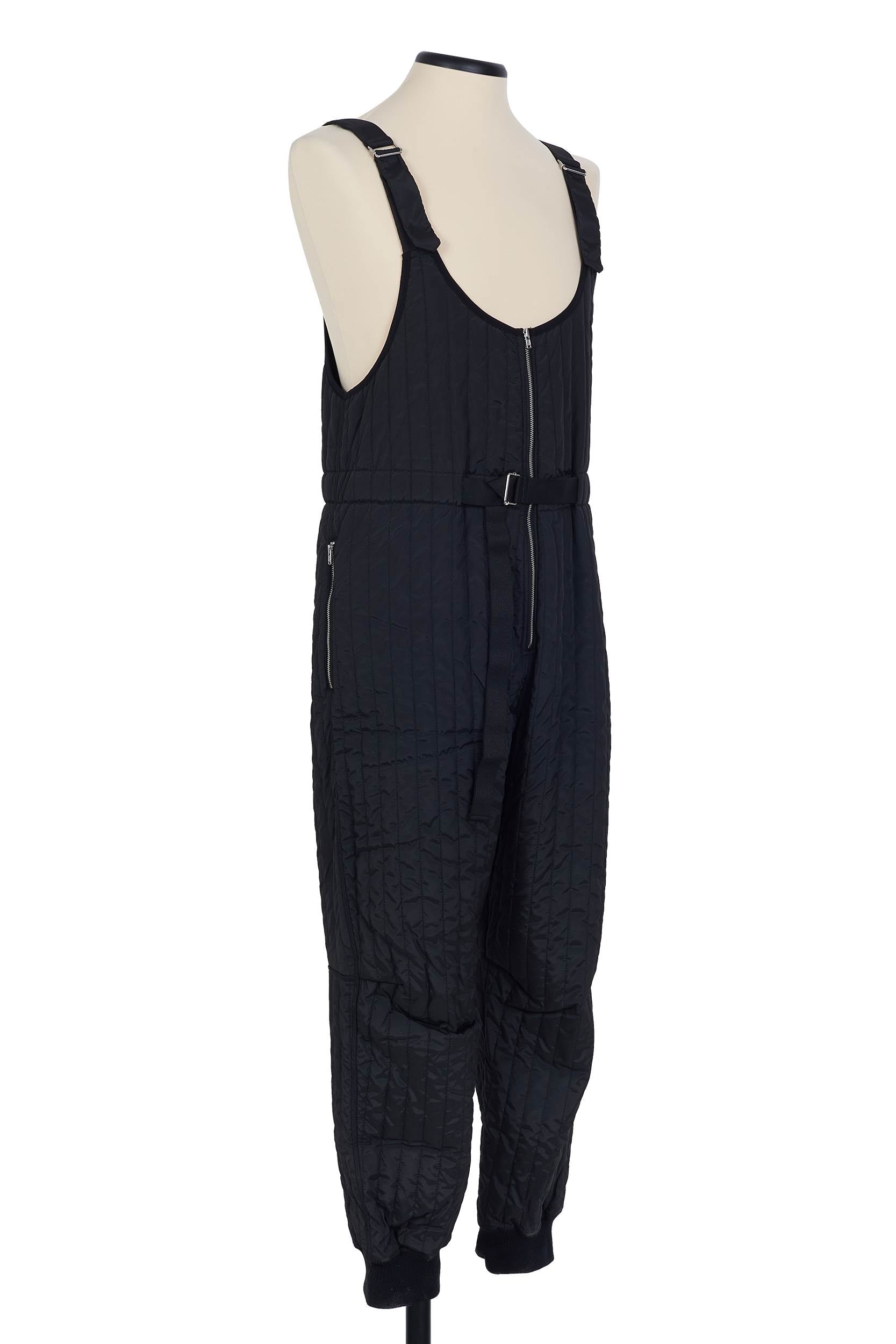 Black quilted salopette by Random Identities. adjustable length detail, 100% polyester