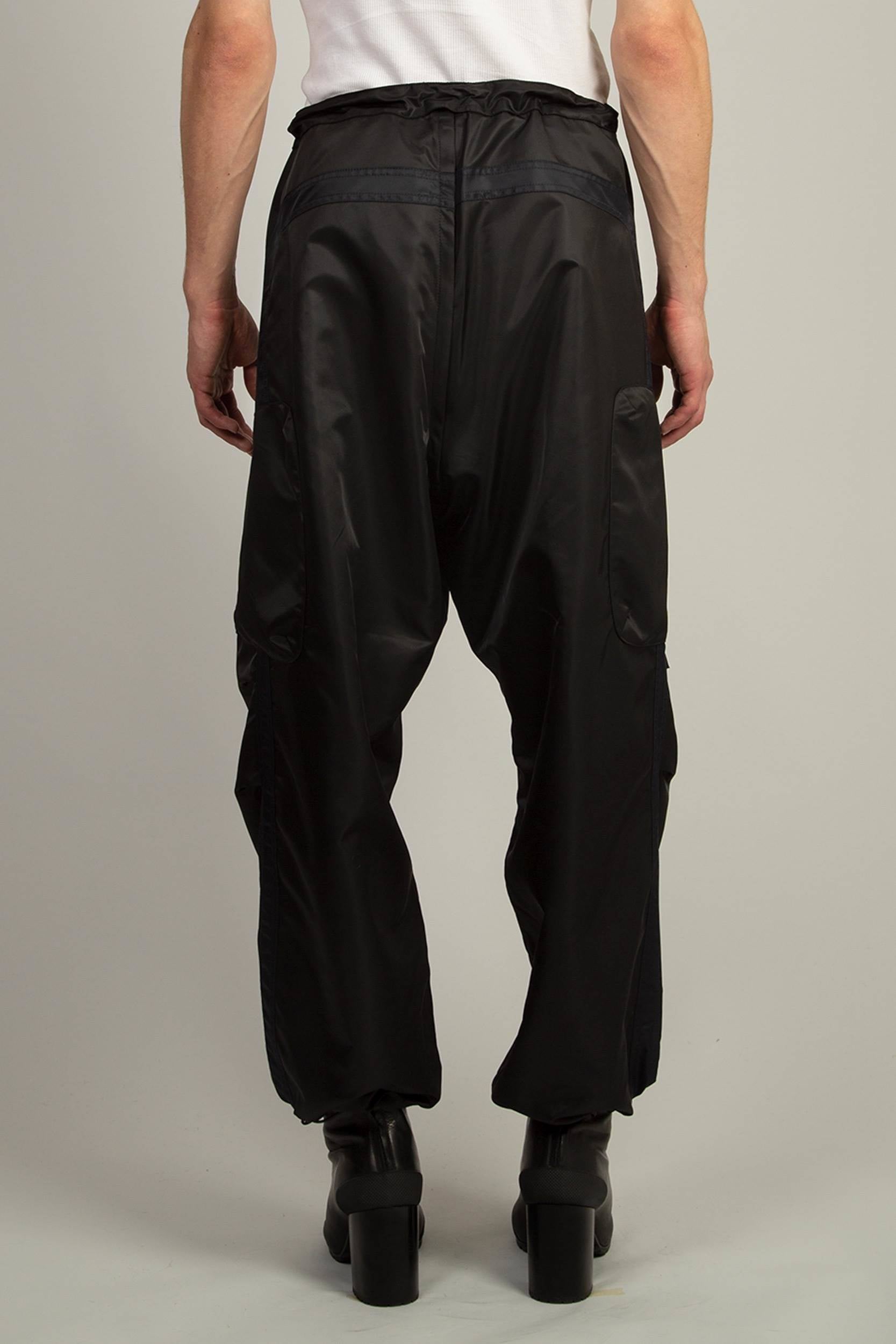 Relaxed fit nylon trousers in Black with adjustable hems