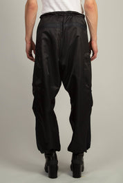 Relaxed fit nylon trousers in Black with adjustable hems