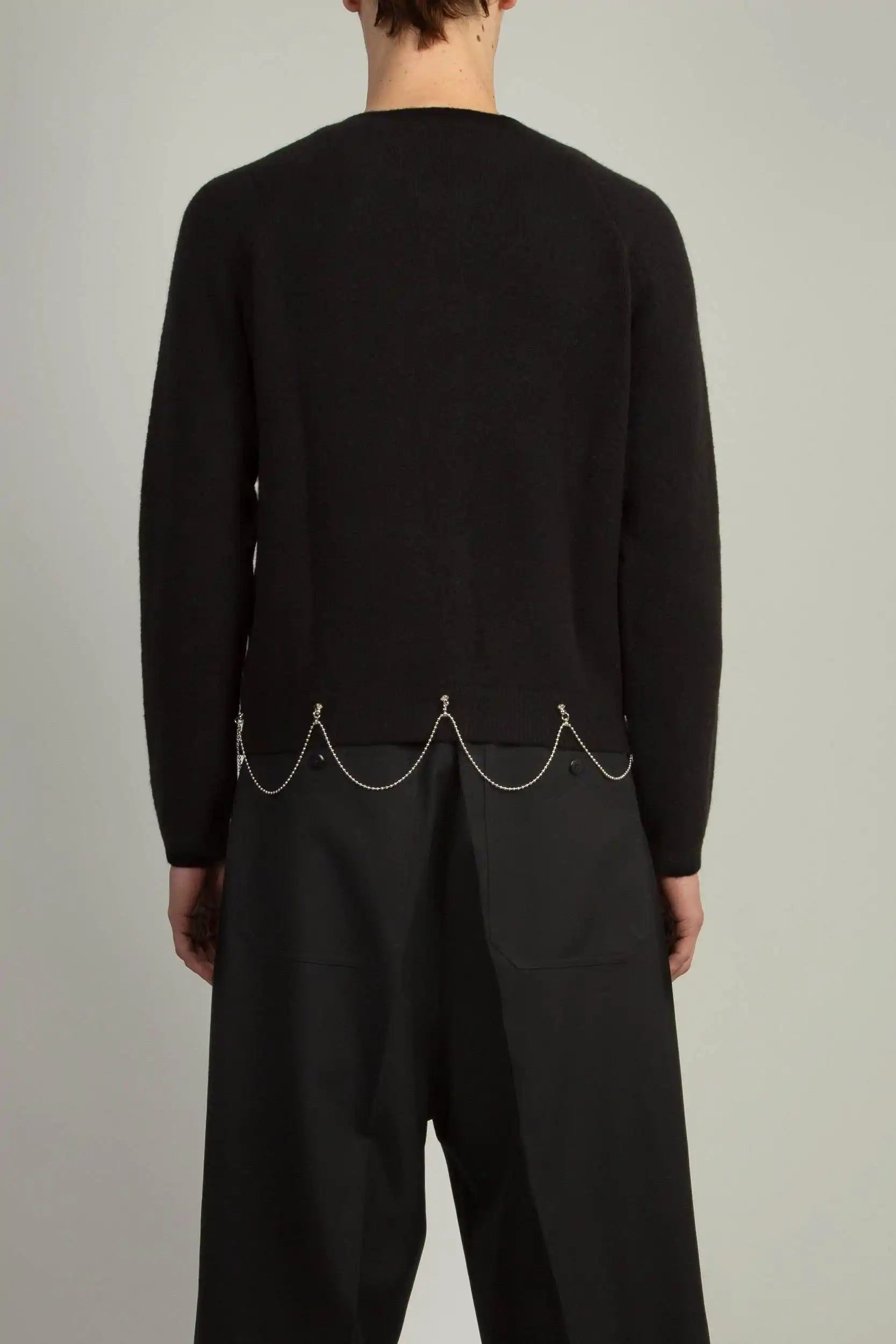 Back view of Black boy’s-fit full-zip cardigan with saddle sleeves by Random Identities