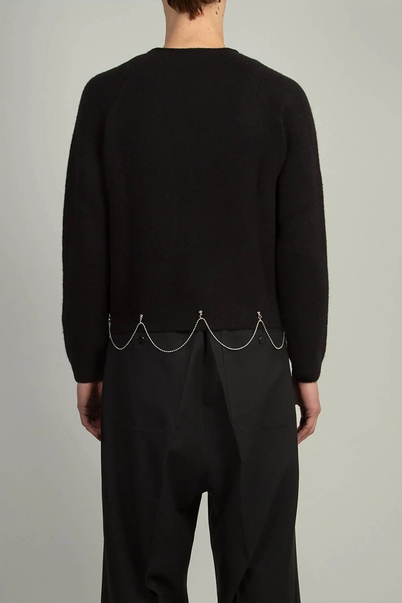 Back view of Black Crew Neck With Chain sweater by Random Identities showing boy’s fit and clean knit silhouette