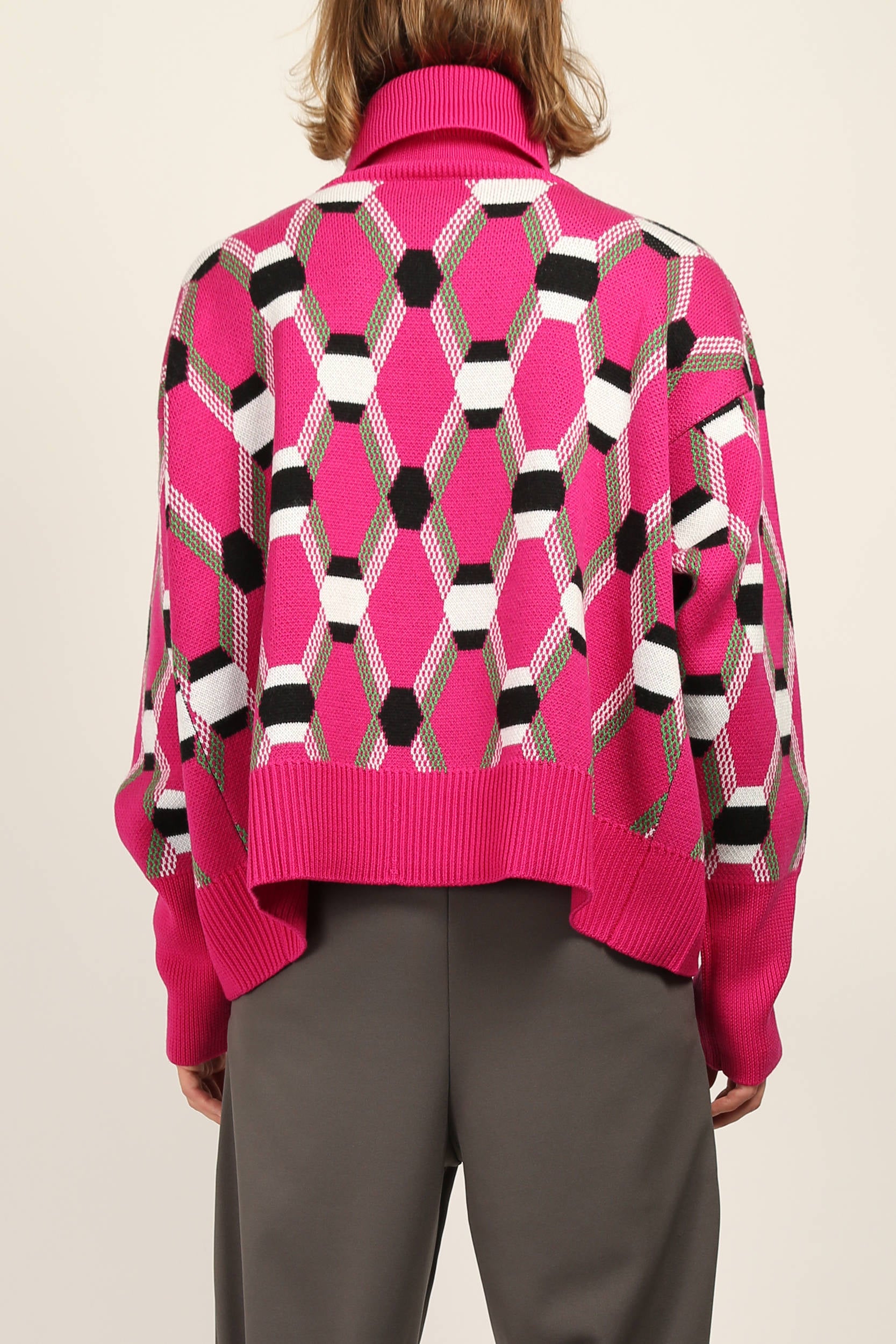 Back view of Pink oversize roll neck jacquard sweater by Random Identities showing mid-gauge knit and relaxed silhouette