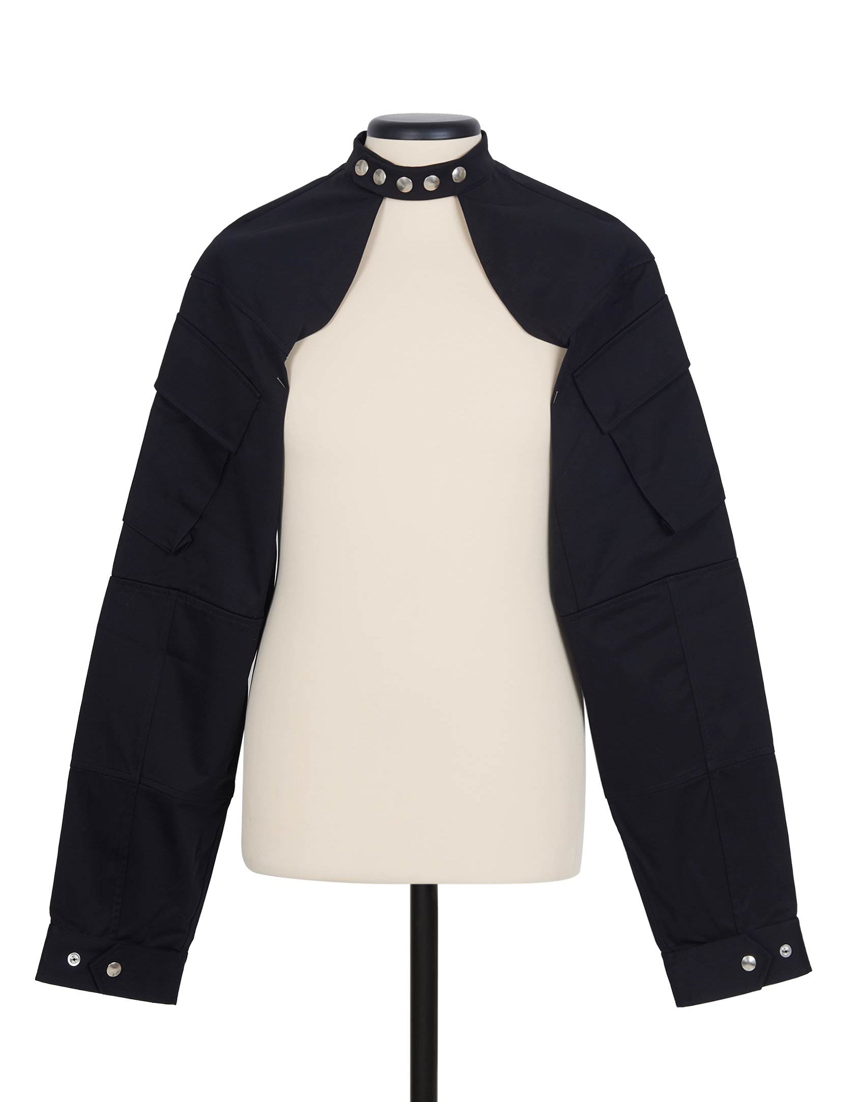 Random Identities Shrug Jacket in Black. collarless with press-button fastening and sleeve cargo pocket