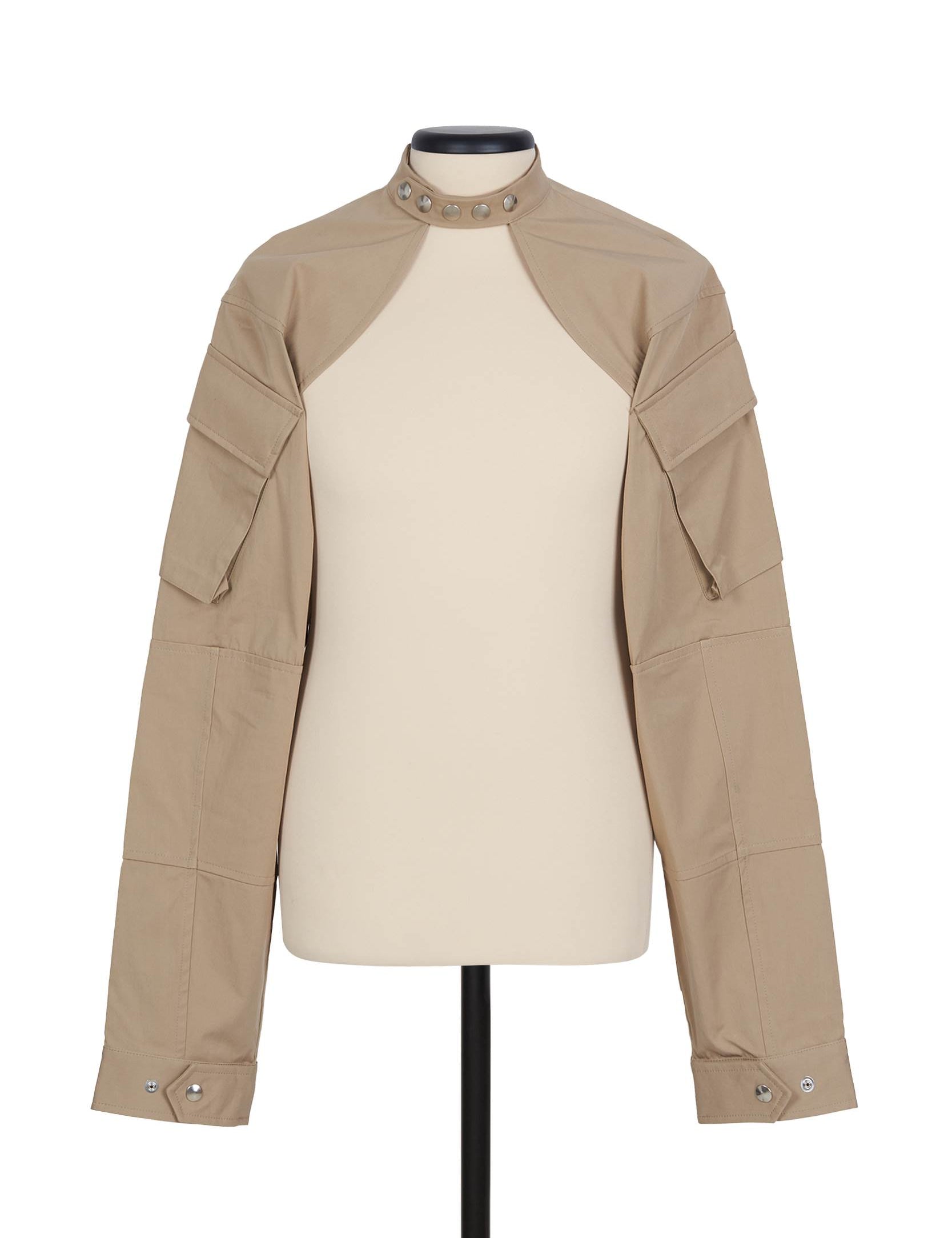 Random Identities Shrug Jacket in Beige. collarless with press-button fastening and sleeve cargo pocket