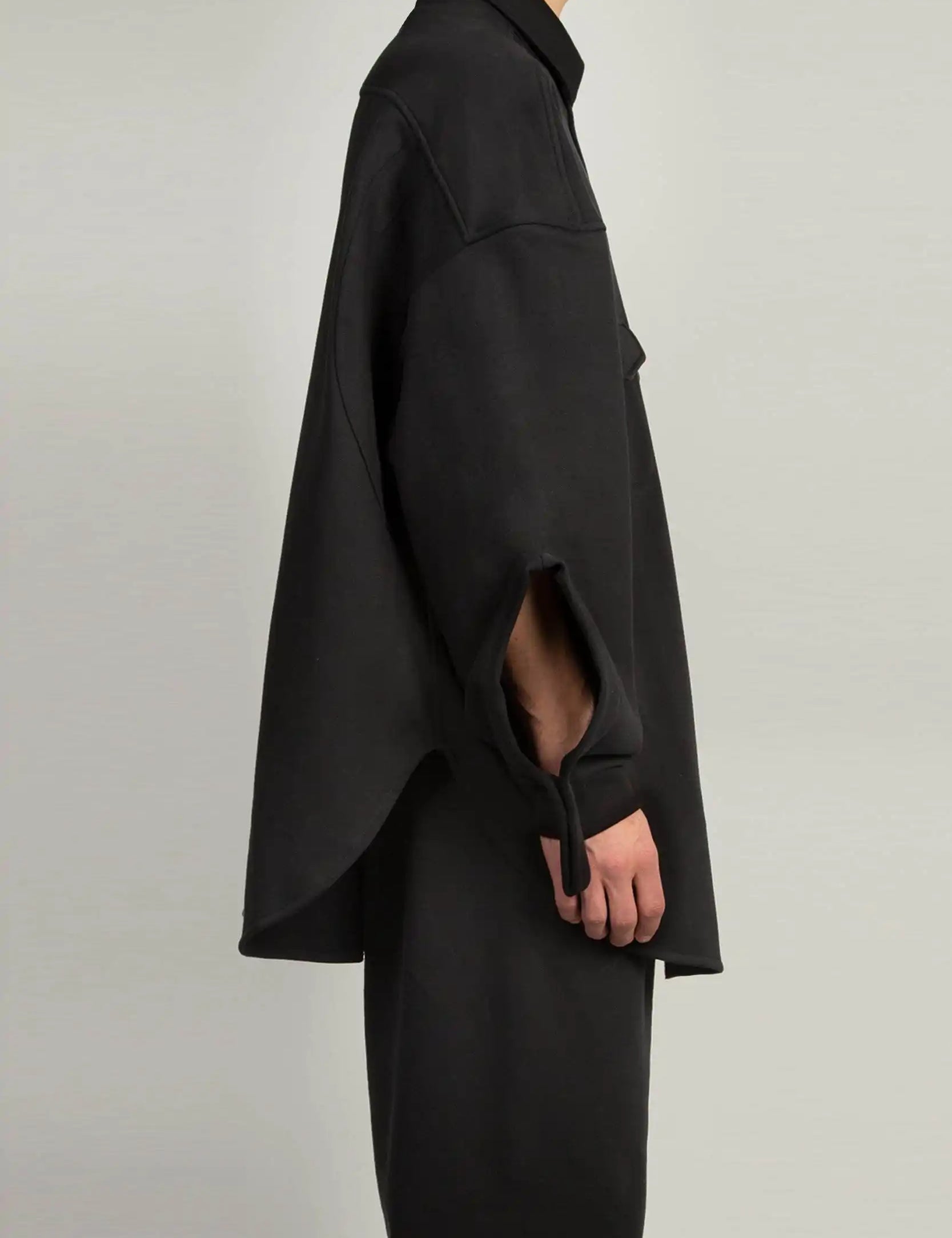 Black sweatshirt-shirt hybrid top featuring a shirt collar