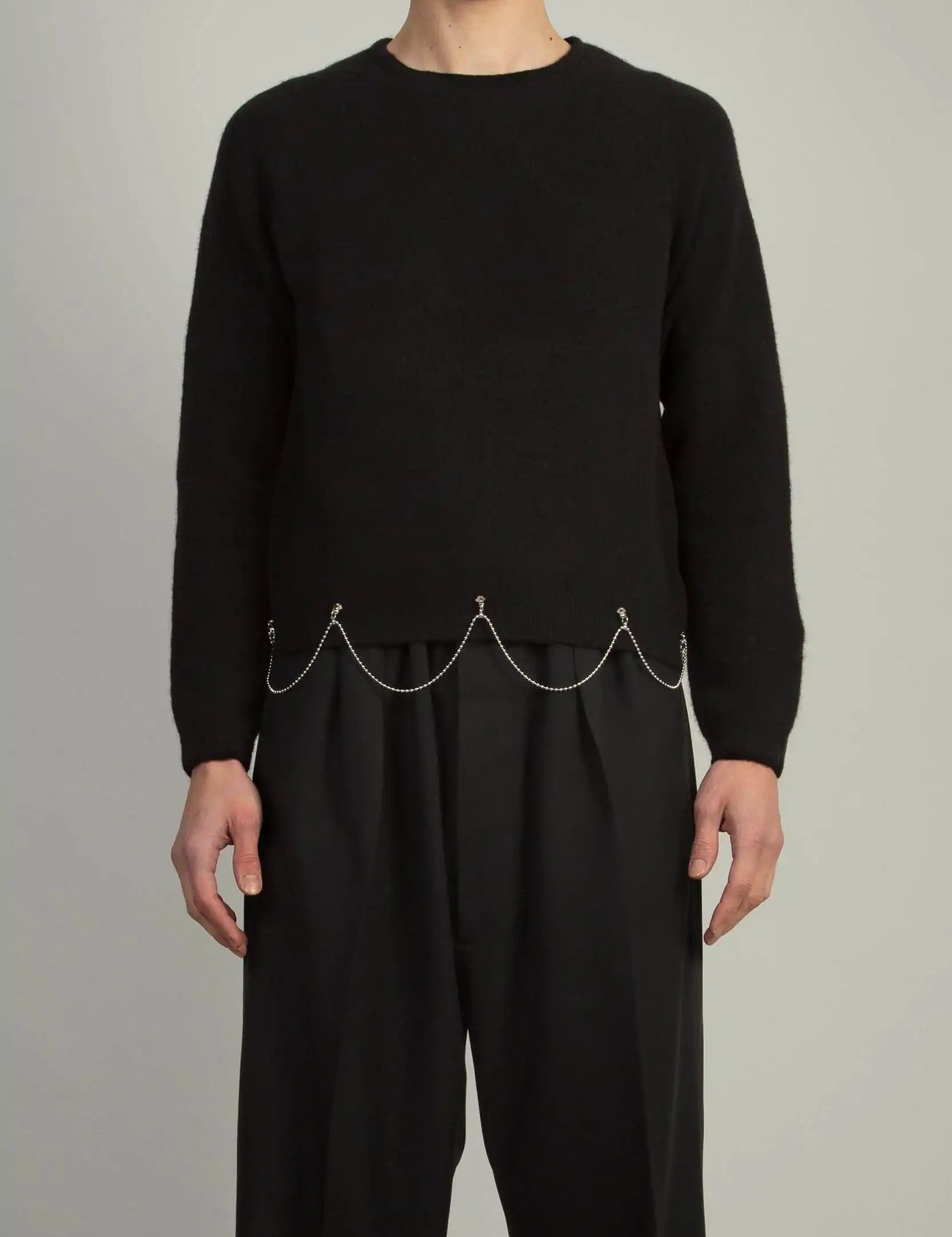 Random Identities Crew Neck With Chain in Black, stretch Shetland wool boy’s fit sweater with saddle sleeves and chain at hem, front view