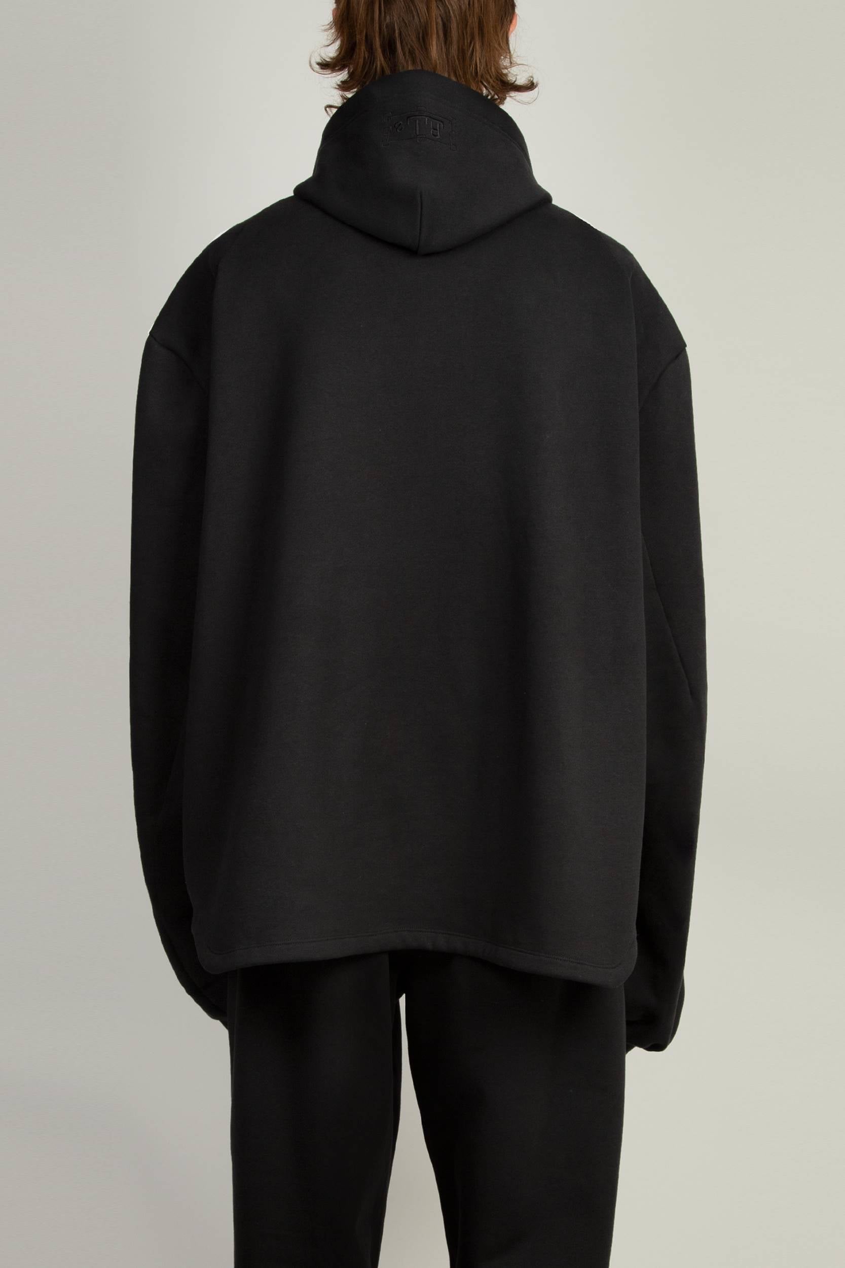 Unisex black jersey hoody featuring cutout detailing