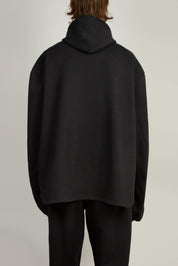 Unisex black jersey hoody featuring cutout detailing