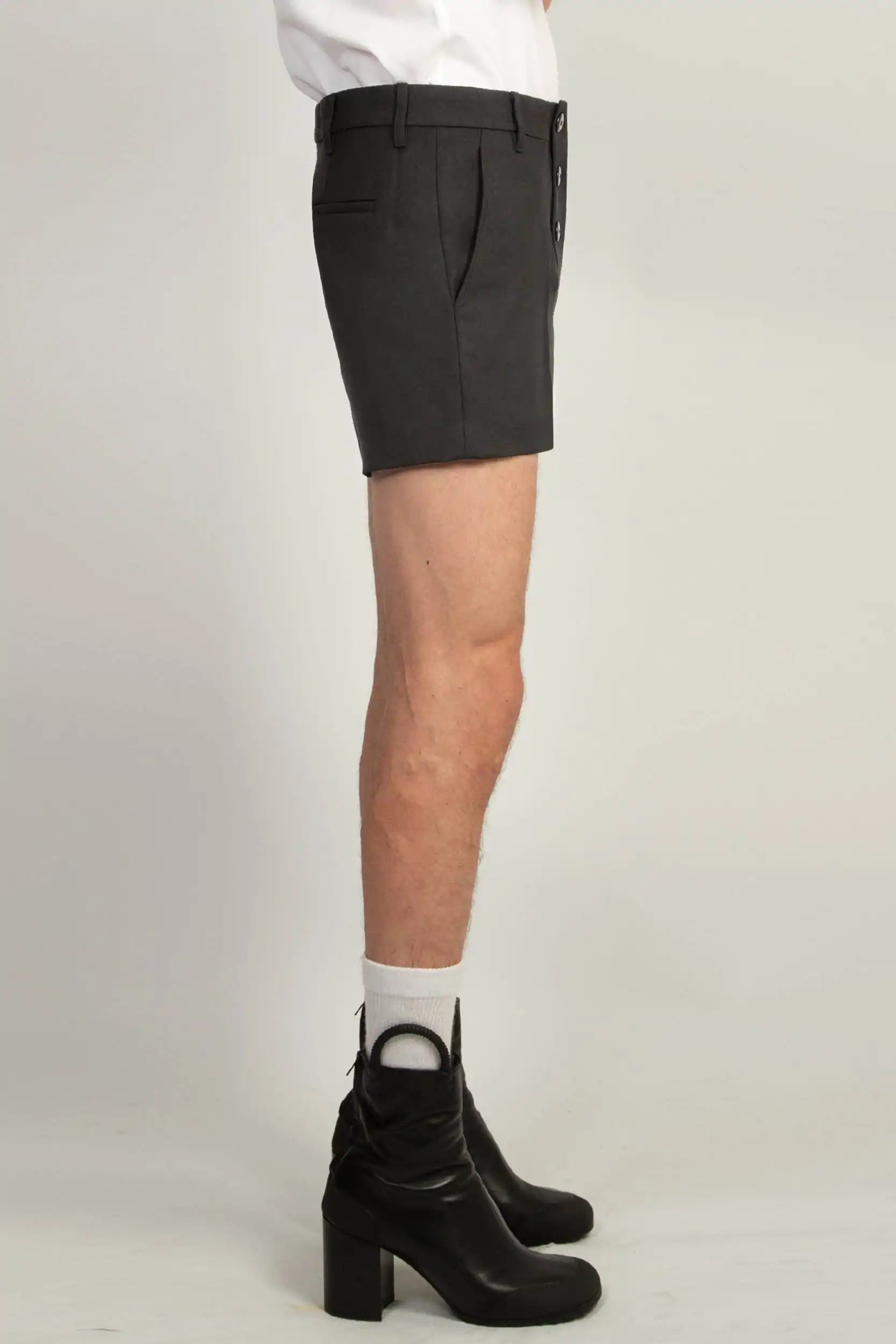 Black gaberdine tailored shorts by Random Identities featuring distinctive six double-button fastening