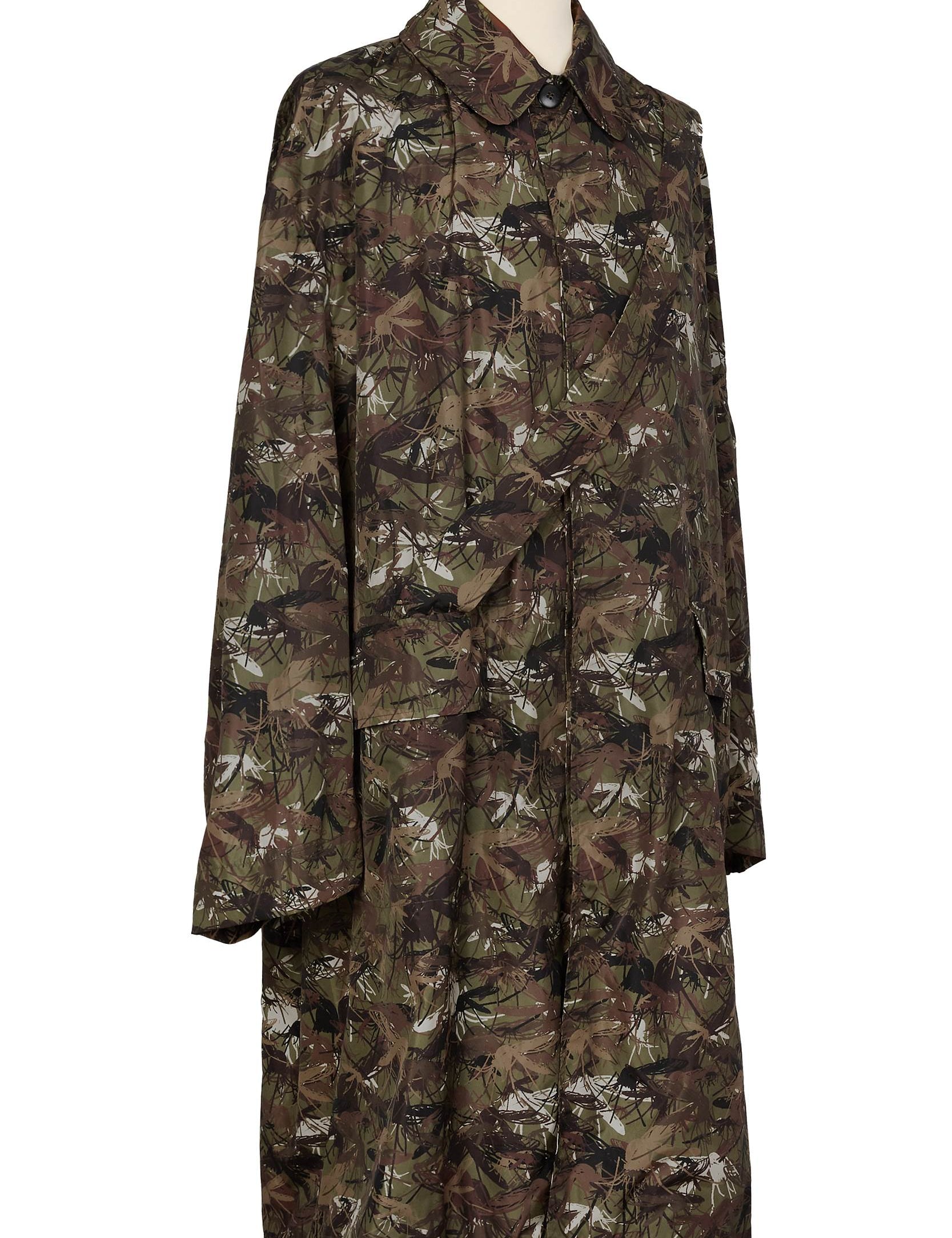 Camouflage raincoat with strap detail by Random Identities, profile view
