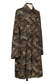 Camouflage raincoat with strap detail by Random Identities, profile view
