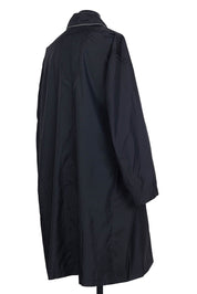 Random Identities Black raincoat featuring diagonal self‑fabric strap and contrast piping