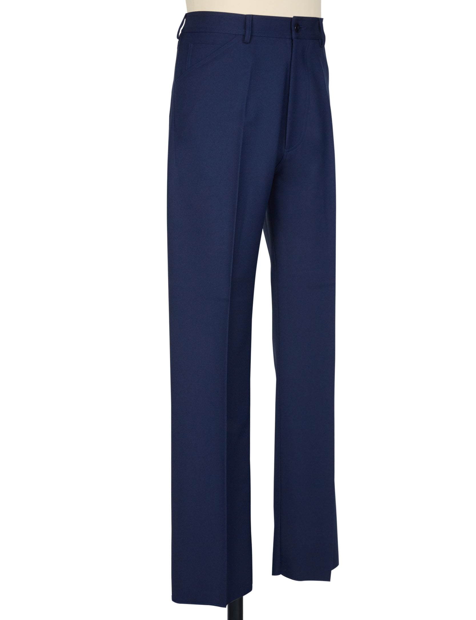 Navy high-rise trousers. single jet back pockets and yoke insert, polyester gabardine