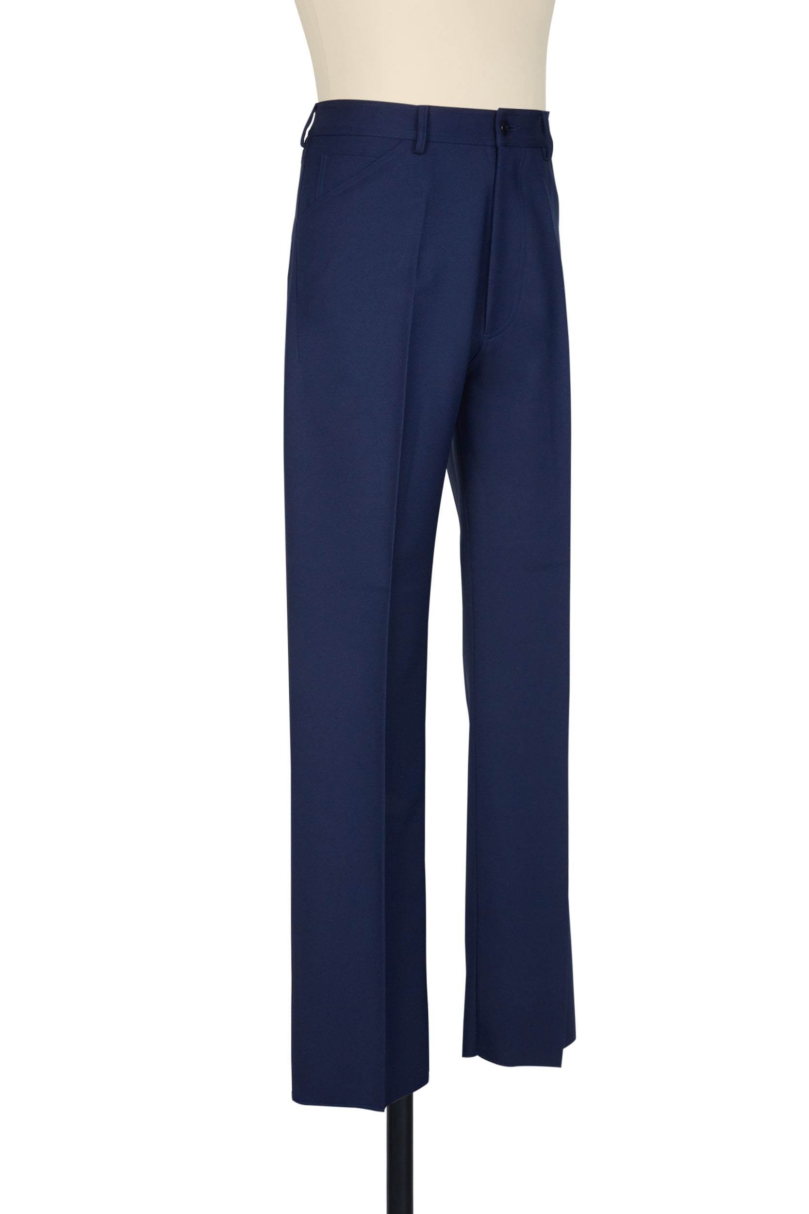 Navy high-rise trousers. single jet back pockets and yoke insert, polyester gabardine