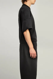 Side view of Black crew neck short sleeve sweatshirt with elasticated sleeve hem and emphasised back by Random Identities