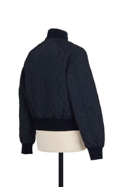 Quilted Bomber in Black. 100% polyester, regular fit, ribbed finishings