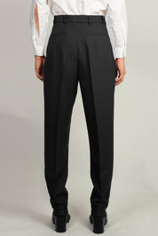 back view of Black Pleated Tapered Trouser by Random Identities showing tapered leg and clean tailored lines