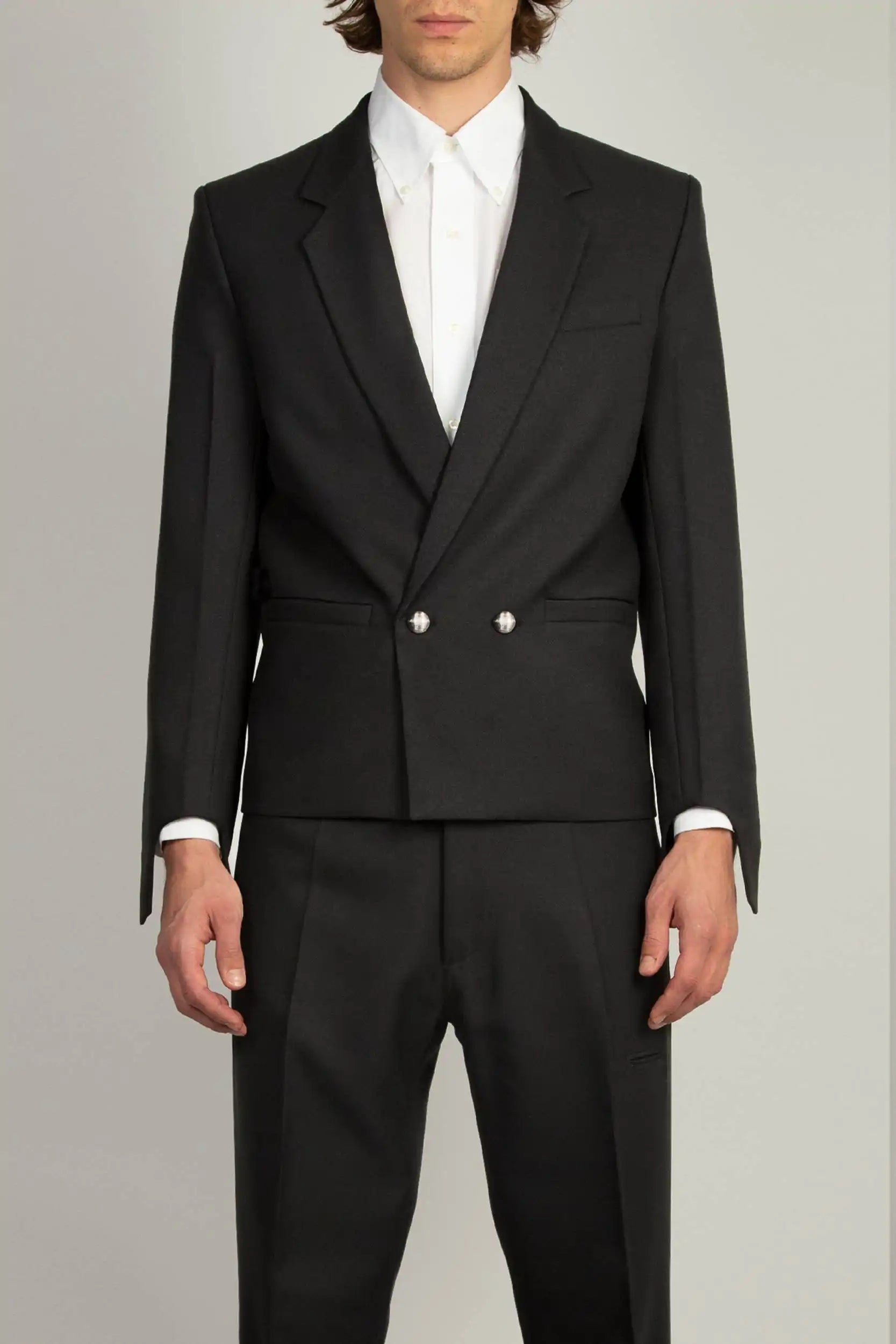 Random Identities Coco Blazer in Black, double-breasted gaberdine with two metal buttons and glove-cuff sleeves, front view