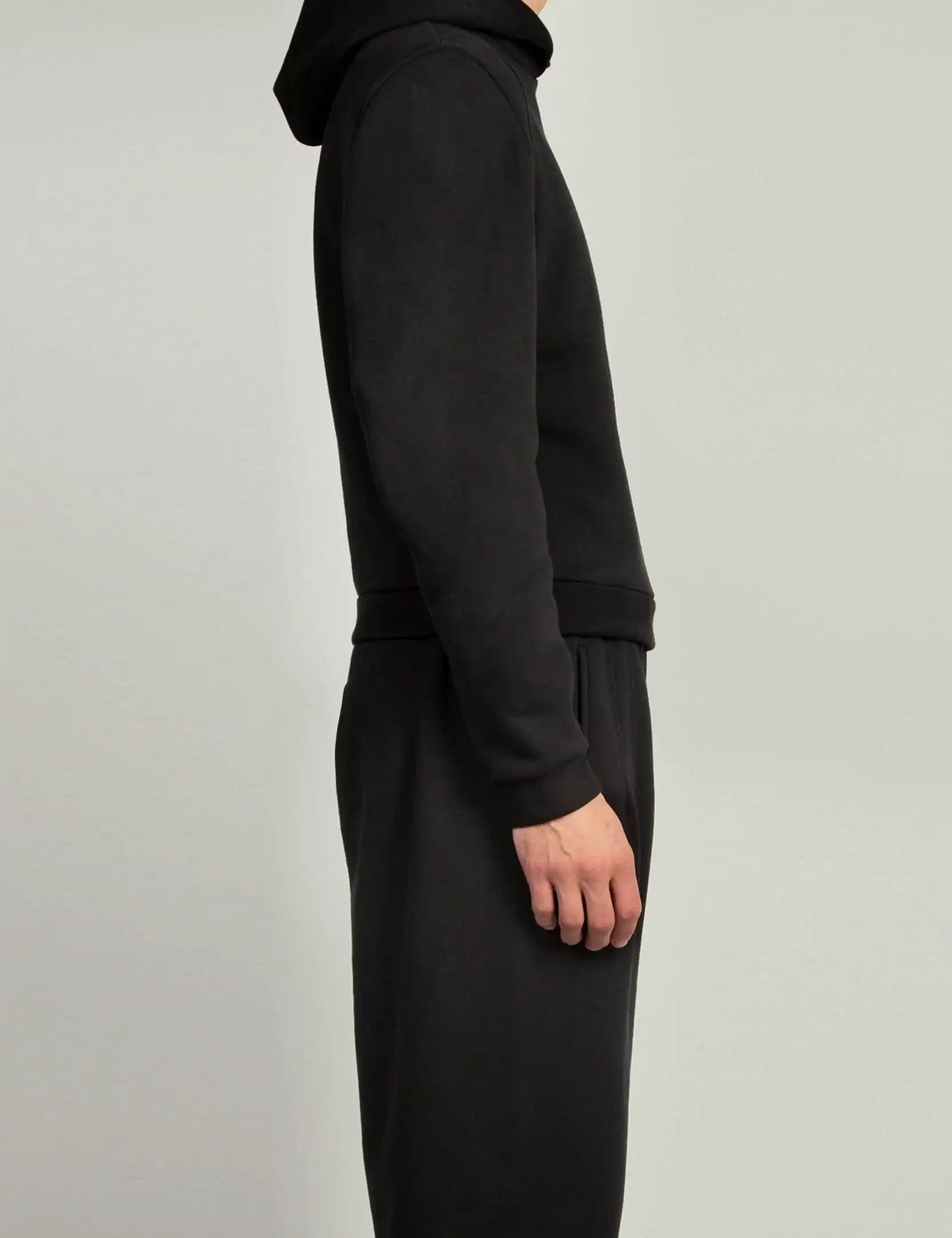 Black hooded sweatshirt with constructed shoulders and self-fabric trims by Random Identities