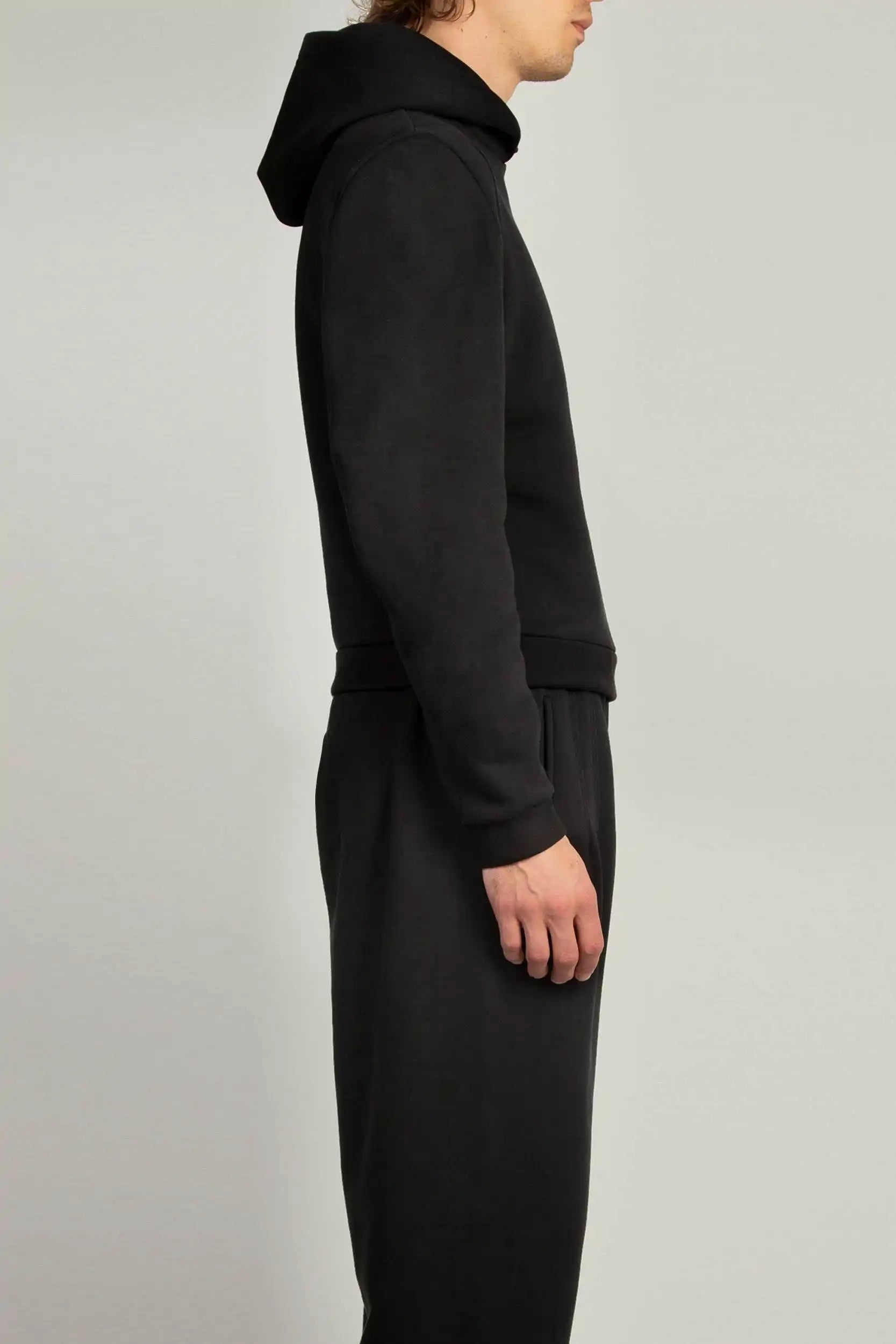 Black hooded sweatshirt with constructed shoulders and self-fabric trims by Random Identities