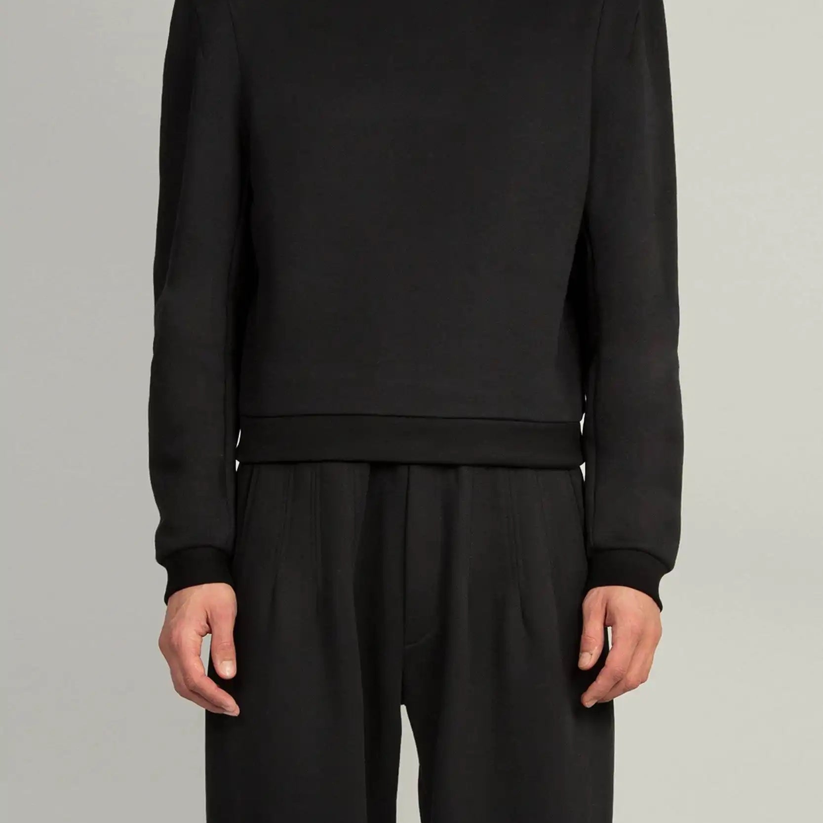 Random Identities Constructed Shoulder Hoody in Black with two-piece sleeve and darted sleevehead, front view