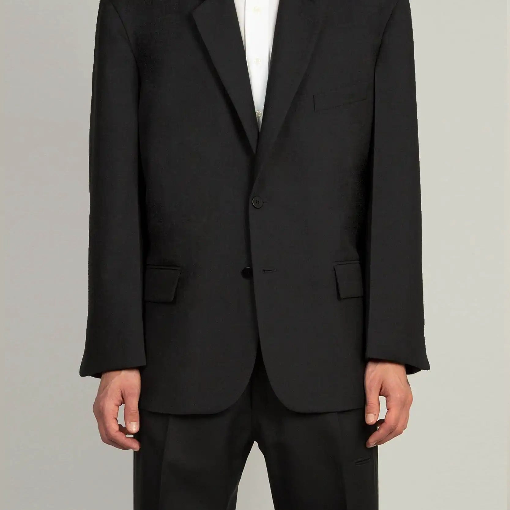 Random Identities 80s Blazer in Black with defined shoulders, clean lapels, and flap pockets, front view