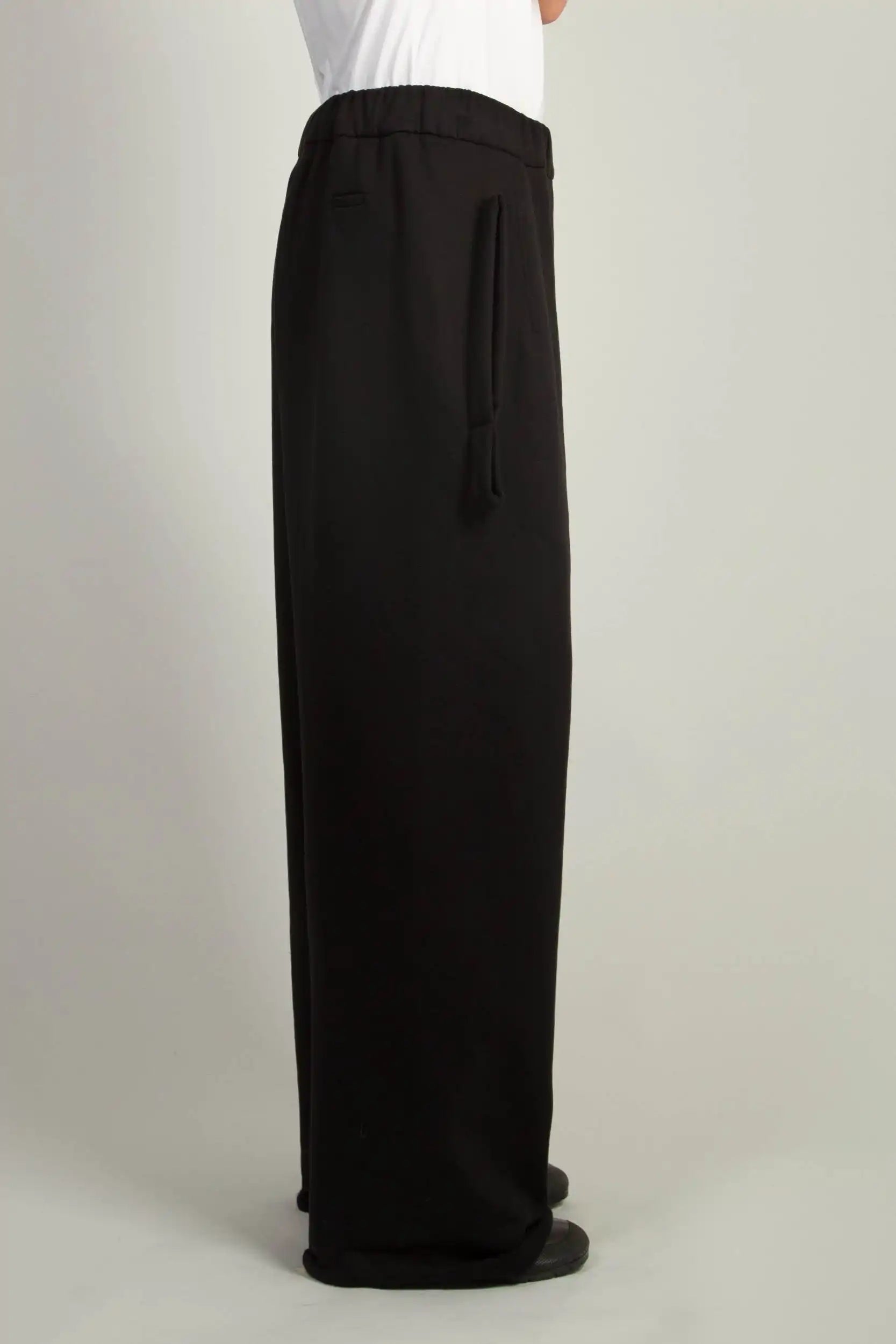Black Wide Sweatpant by Random Idities showing dart details at front, elasticated waist, and coulisse