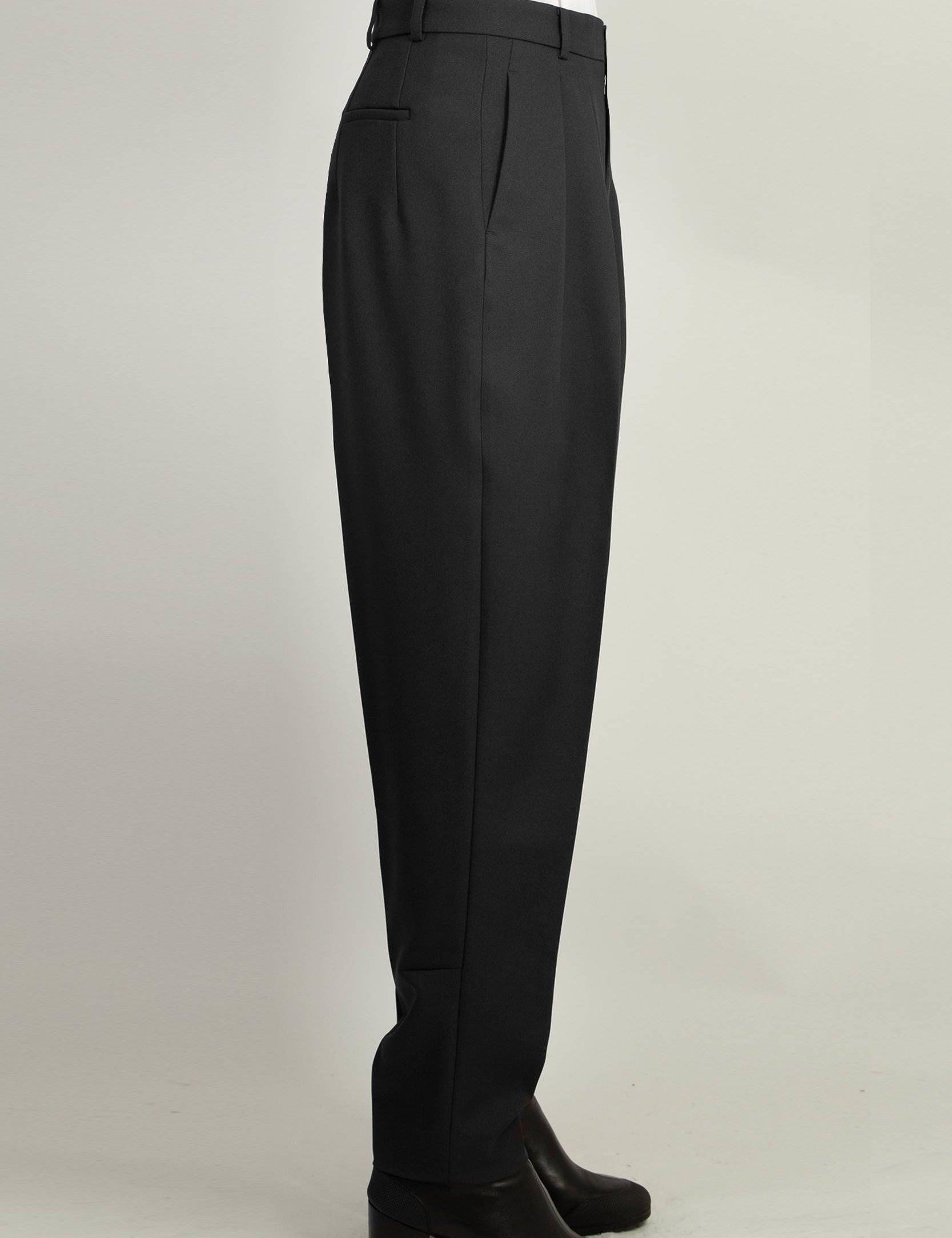 Black Pleated Tapered Trouser by Random Identities styled with buttonless blazer, tapered leg silhouette